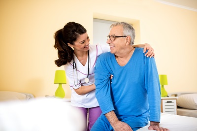 Smiling happy senior man at nursing home